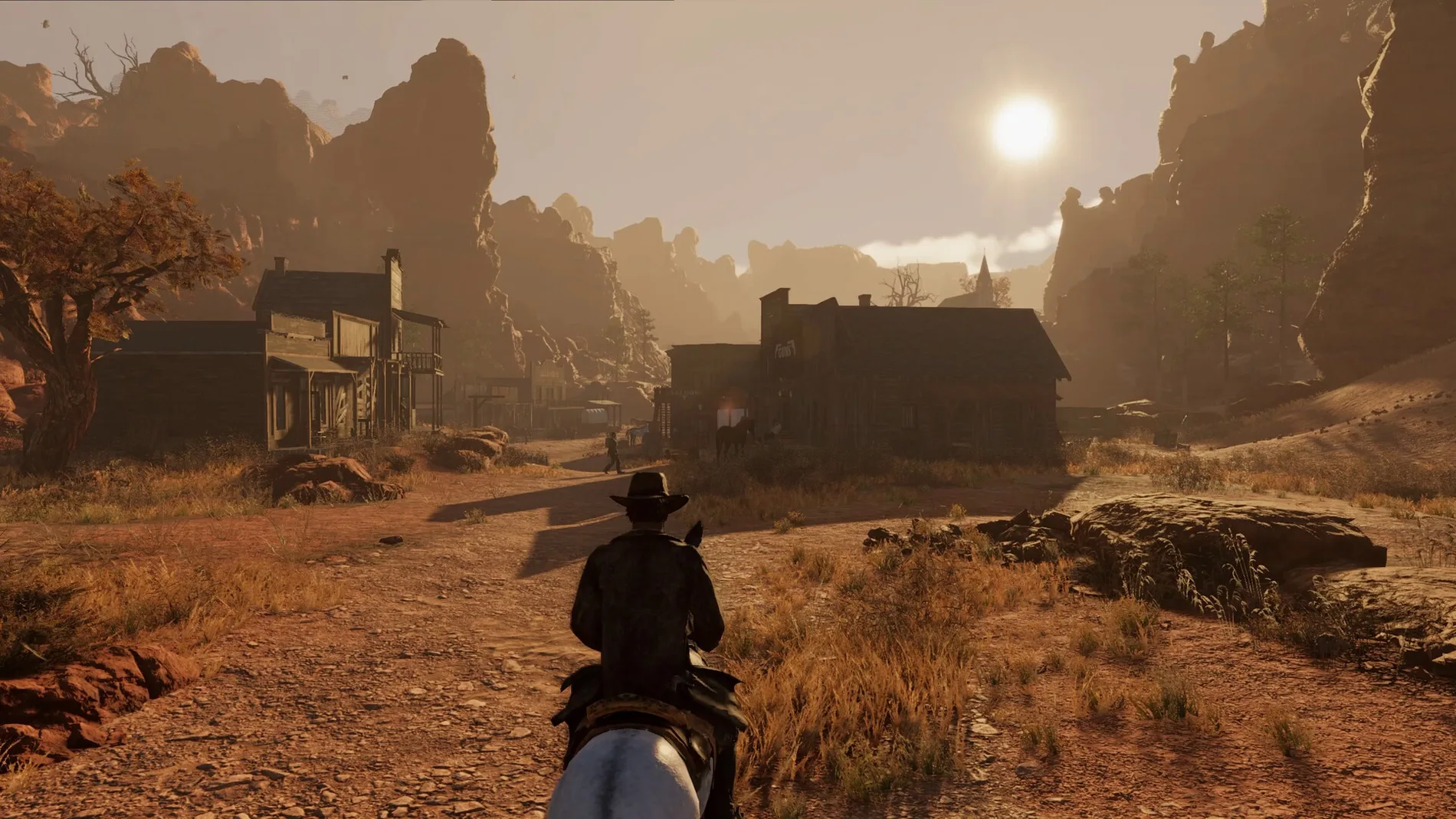 Wild West Legacy — riding towards a desert town at sunset